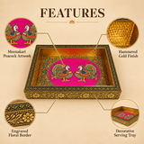 Product feature infographic highlighting four key specifications of an ornate handcrafted serving tray, including circular zoomed-in callouts pointing to its vibrant Meenakari peacock artwork on a pink base, hammered gold metal interior finish, intricate engraved floral border along the outer frame, and its multipurpose design as a decorative serving tray.