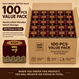 Bulk order 100 pcs value pack graphic for Ashtok handcrafted wooden maroon velvet storage boxes. The banner displays a large cardboard shipping box filled with stacked rows of maroon velvet jewellery boxes, representing a wholesale quantity of 100 pieces total. One individual maroon velvet box with antique gold latch detail sits beside the main bulk carton under text reading '100 PCS VALUE PACK'.