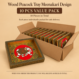 Promotional banner for a 10 PCS Value Pack of handcrafted wooden Meenakari trays with royal elephant designs. An open brown cardboard carton holds 10 individually packed rectangular trays lined up neatly in two rows inside. A single sample wooden tray with a vibrant white-and-gold decorated elephant artwork on a red background sits leaning against the front left corner of the box over a warm beige background.