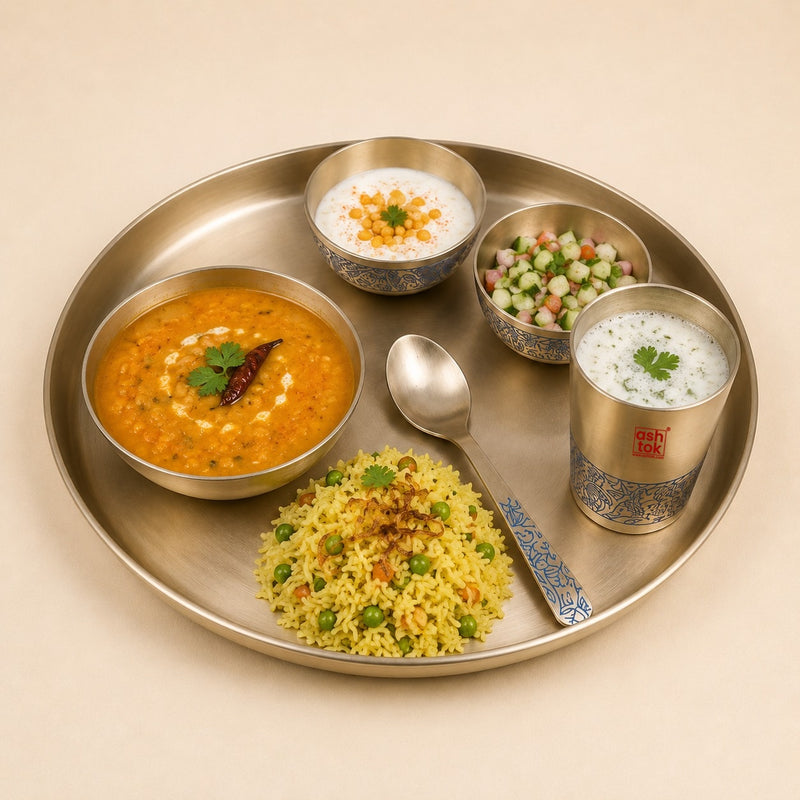 Kansa bronze thali set with serving bowls and spoon for traditional Indian dining