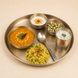 Kansa bronze thali set with serving bowls and spoon for traditional Indian dining