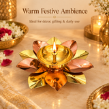 Lifestyle image of a brass and copper lotus akhand diya styled in a warm festive setting, showing how the diya can be used as a beautiful decorative and spiritual accent for pooja spaces, festive home décor, Diwali decoration, prayer corners, mandir arrangements, and traditional celebrations, with the lotus flower form and polished dual-metal finish adding an elegant handcrafted look to the overall ambience.