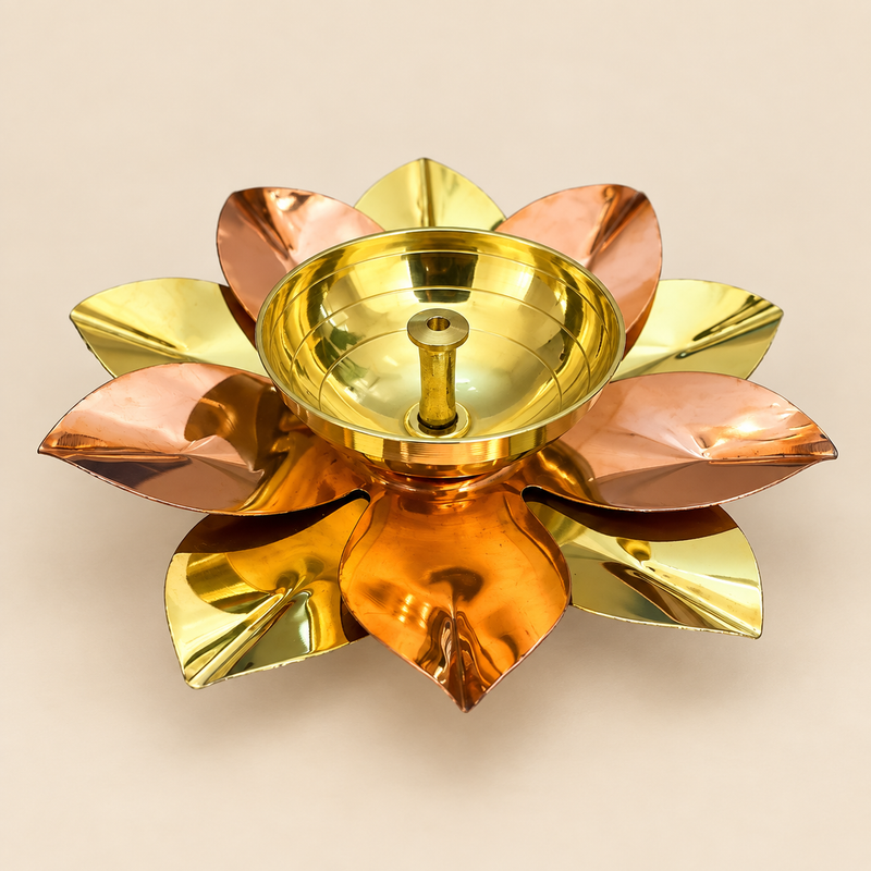 Brass and copper lotus diya raw product image on a soft beige background, showing a decorative akhand diya designed in a lotus flower shape with alternating brass-toned and copper-toned petals, a round central oil holder, and a traditional handcrafted finish, ideal for pooja décor, festive decoration, return gifts, and traditional gifting for Diwali, Navratri, housewarming, weddings, and spiritual occasions.