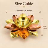 Size guide image of a brass and copper lotus akhand diya displayed on a beige background, clearly showing the dimensions of the diya with diameter 4 inches and height 2 inches, featuring a lotus-shaped base with polished dual-tone brass and copper petals and a round top diya holder, helping customers understand the exact size and proportions of this decorative traditional oil lamp for pooja use, festive décor, and return gifting.