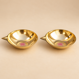 Set of 2 Matt Finish Brass Pankti Diyas with wide shallow oil bowls, pointed traditional spouts and smooth polished brass finish, displayed on a clean beige studio background. Each brass diya measures 5 inches in diameter and 1.5 inches in height, suitable for pooja, festive decoration, Diwali lighting and traditional home decor.