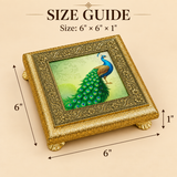 Size guide image of Meenakari Design Chowki Peacock showing the decorative square chowki with an ornate gold-toned carved frame, raised legs, and a central peacock artwork, along with the product dimensions of 6 inch x 6 inch x 1 inch on a soft beige background.