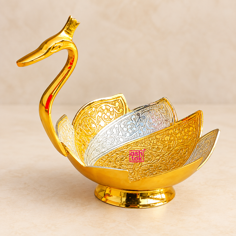 Meenakari duck design gift bowl featuring an elegant golden duck-shaped body with layered gold and silver decorative panels, intricate floral detailing and a raised round base, professionally displayed on a premium beige studio background for gifting and home decor.