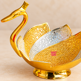 Close-up view of Meenakari Duck Design Gift Bowl highlighting the intricate floral embossing, layered gold and silver decorative panels, polished golden duck neck, curved bowl structure and raised base, showing the fine craftsmanship and detailed finish of the gift item.