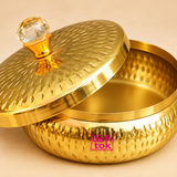 Close-up image of metal dryfruit gift box showing the polished golden surface, hammered texture, smooth inner storage space, fitted lid edge and crystal-style top knob, highlighting the fine finish and elegant craftsmanship of the gift box.