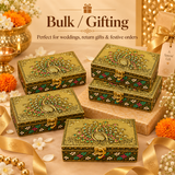 Peacock design decorative storage boxes arranged for bulk gifting, ideal for wedding return gifts, festive gifting, corporate gifts, family functions and special occasions with an ornate traditional golden finish.