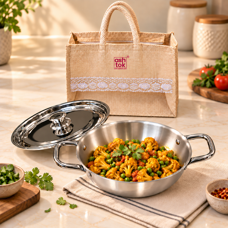 Prestige Triply Kadai with Lid 1.2 L 9 inch with bag shown in kitchen lifestyle setting with cooked food