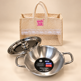 Prestige Triply Kadai with Lid 1.2 L 9 inch with bag on beige studio background