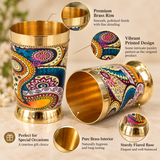 Detailed close-up image of brass glasses with printed design highlighting the smooth polished brass rim, pure brass interior, vibrant paisley-style artwork, decorative detailing and sturdy flared base. The close-up clearly shows the finish, texture and craftsmanship of the premium drinkware, making it ideal for customers looking for elegant brass glasses for special occasions and gifting.