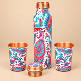 Printed copper bottle with glass set featuring 1 litre bottle and 2 matching copper glasses on beige background