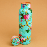 Printed copper water bottle with floral design and cap removed, leak-proof Ayurvedic copper bottle for healthy drinking water, home, office, and travel.