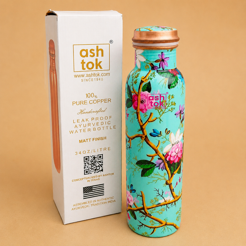 Printed pure copper water bottle with colorful floral design and leak-proof copper lid, 1 litre capacity, includes branded gift box, ideal for Ayurvedic drinking water, travel, office, gym, and gifting.