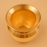 Top view of a pure copper lota with a polished finish on a beige studio background, ideal for storing drinking water, Ayurvedic wellness, pooja rituals, and traditional home use.