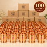 Bulk presentation of 100 pure copper mugs arranged in front of plain packaging boxes, suitable for wholesale orders, corporate gifting, weddings, hospitality businesses, restaurants, events and large quantity drinkware requirements.