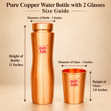 Size guide of a pure copper water bottle with matching drinking glass showing bottle height of 11 inches and diameter of 3 inches, alongside glass height of 3.8 inches and diameter of 3 inches. Measurement arrows illustrate the dimensions of the curved copper bottle and copper drinking glass on a beige studio background.