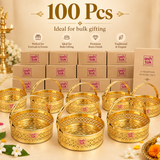 Bulk presentation of 100 Round Shaped Brass Puja Baskets, Phool Butti Flower Baskets for large gifting and event requirements. Multiple golden decorative baskets are shown with ASHTOK branded packaging, intricate cutwork, sturdy carrying handles and traditional embossed detailing, suitable for wholesale orders, wedding return gifts, festive gifting, corporate gifting, temple events, religious ceremonies and large quantity gift distribution.