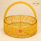 One piece round metal wire flower basket with decorative golden openwork body and curved carrying handle, presented on a clean beige studio background for individual gifting, floral arrangements and decorative use.