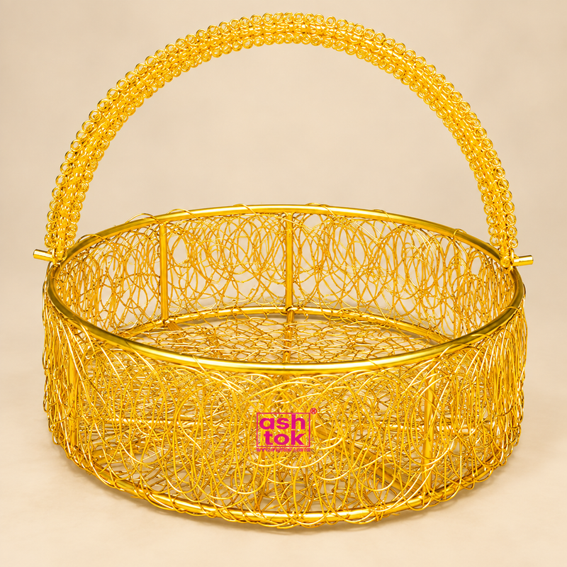 Round shaped metal wire flower basket featuring a bright golden finish, circular woven wire body, decorative openwork construction and tall curved handle, professionally displayed on a premium beige studio background for gifting, flower presentation and decorative use.