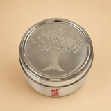 Top view of a round stainless steel tiffin box with an engraved tree design lid, durable food storage container for lunch, snacks, and meal preparation.