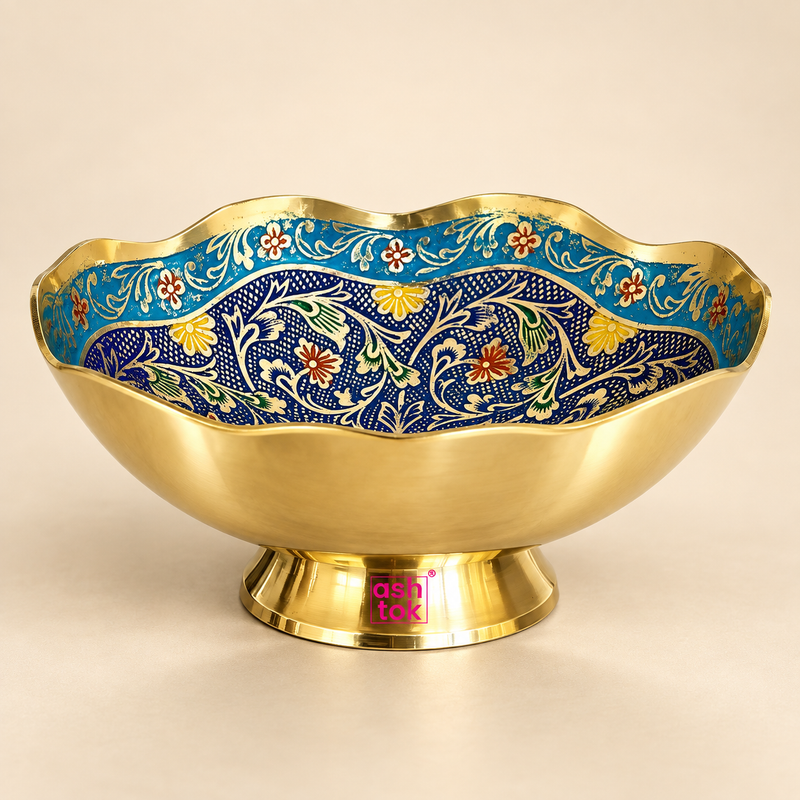 Decorative Turkish style brass gift bowl with multicolor Meenakari work displayed as a single premium serving bowl on a clean warm beige studio background. The bowl features a polished golden brass exterior, elevated circular pedestal base, distinctive scalloped wavy rim and detailed hand-finished enamel-style floral artwork inside in rich blue, turquoise, green, yellow, red and cream tones.