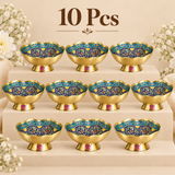 Set of 10 Turkish style brass Meenakari bowls displayed together on an organized beige tiered presentation for return gifting and event orders. Every bowl features a polished golden brass body, raised pedestal base, decorative scalloped rim and coordinated multicolor Meenakari floral pattern with deep blue, turquoise, cream, green, yellow and red detailing.