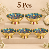 Set of 5 matching Turkish style brass Meenakari gift bowls arranged neatly on a clean beige tiered display. Each bowl features the same polished golden brass exterior, pedestal base, scalloped wavy rim and multicolor floral Meenakari artwork in blue, turquoise, cream, green, yellow and red tones.