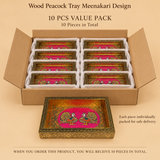 Bulk order 10 pieces value pack graphic for the Wood Peacock Tray Meenakari Design. An open brown shipping box contains 10 rectangular wooden serving trays featuring pink Meenakari dual peacock artwork and gold floral borders, neatly packed in two columns. A single fully visible tray sits in the foreground. Text overlays confirm '10 PCS VALUE PACK', '10 Pieces in Total', and note that each piece is individually packed for safe delivery.