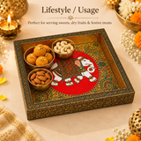 Lifestyle usage image of Wood Peacock Tray Meenakari Design showing the decorative wooden tray styled in a festive setting and used for serving sweets, dry fruits, and festive treats, with elegant traditional decor elements around it.