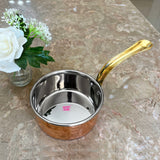 Traditional copper saucepan with ergonomic brass handle, suitable for preparing tea, coffee, sauces, and soups.