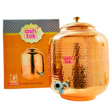 Traditional copper water dispenser made in India with tap, ideal for storing and serving drinking water.